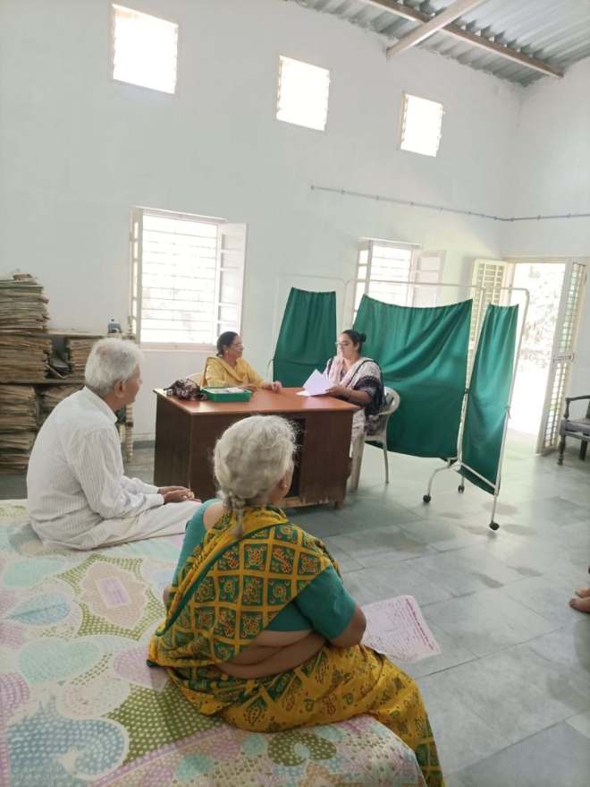 Patrons waiting and being seen inside the wellness camp hall
